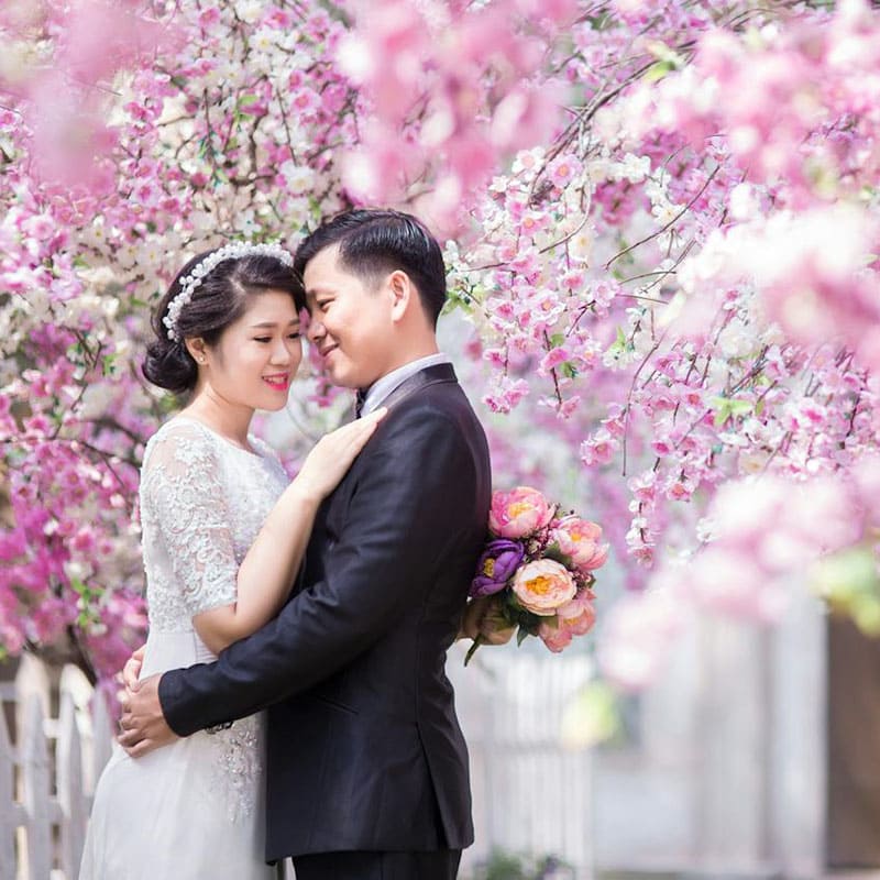 garden wedding with pink flowering tree background
